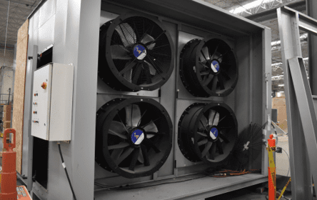 Four large black cooling fans mounted inside a metal frame.